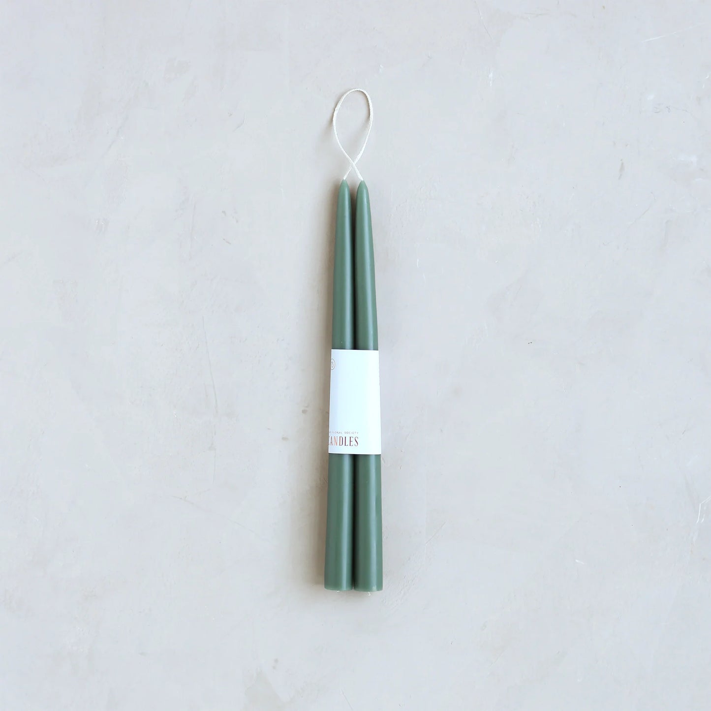 Fancy taper candles in Moss