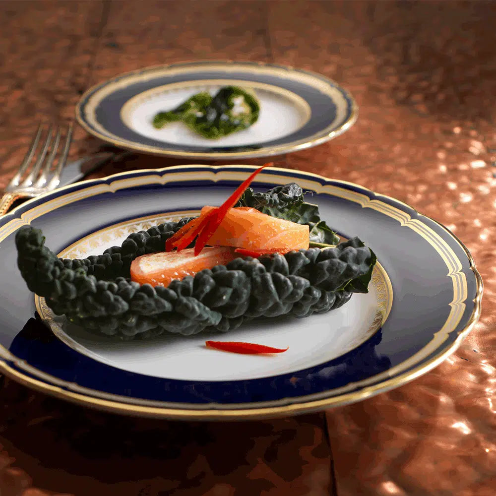 Ashbourne Salad Plate, made in England from fine bone china with 22-carat gold accents. Elegant and refined, perfect for special occasions. Diameter: 21cm (8 inches). Handwash recommended, not suitable for microwave use