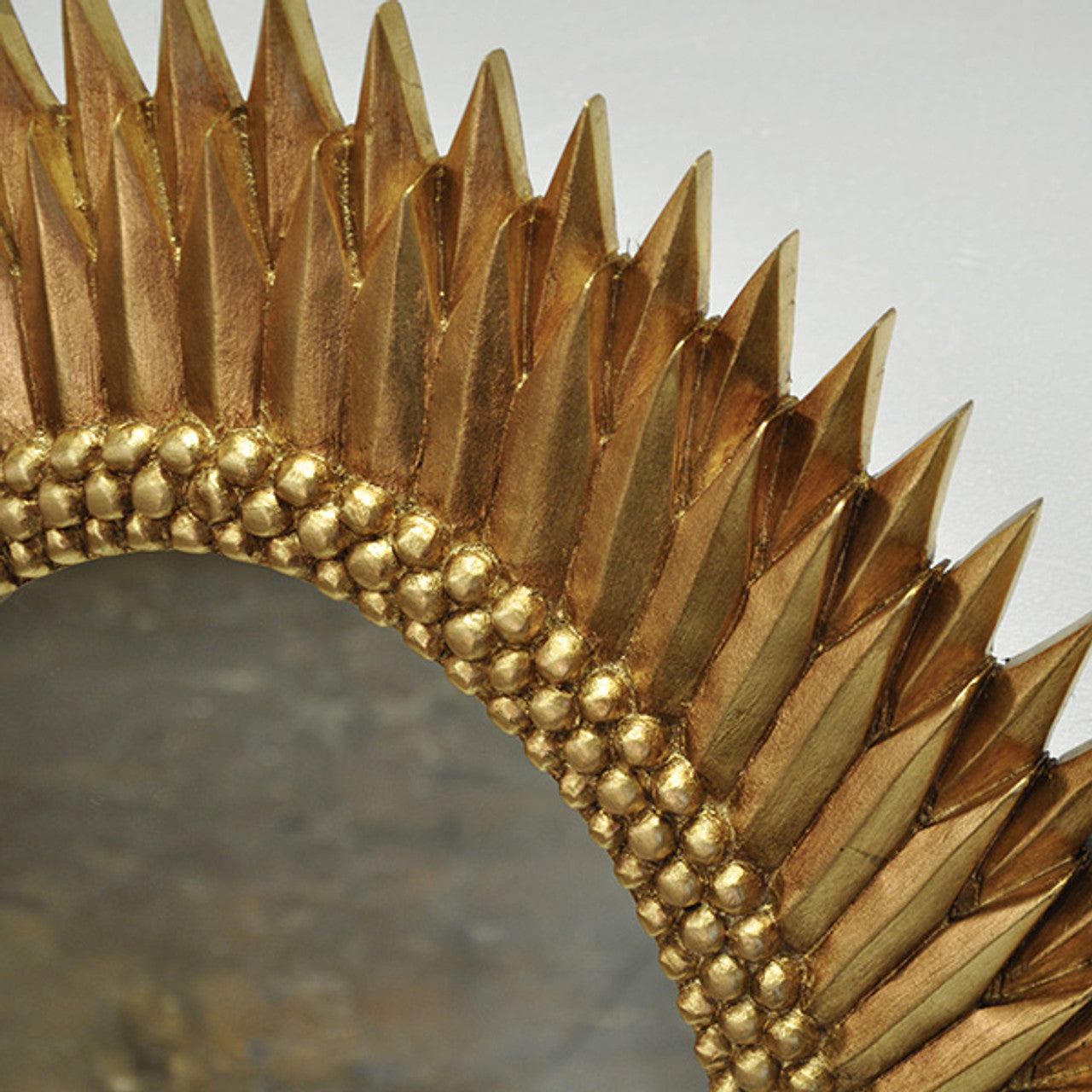 Elegant Gold Leaf Oval Mirror with Starburst Design