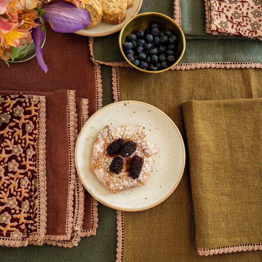 Anika Olive Linen Tablecloth, custom made, measuring 58" x 120". Made from garment-washed heavyweight linen with delicate lace detailing. Easy to clean with machine wash and iron if needed. Perfect for enhancing your dining table.