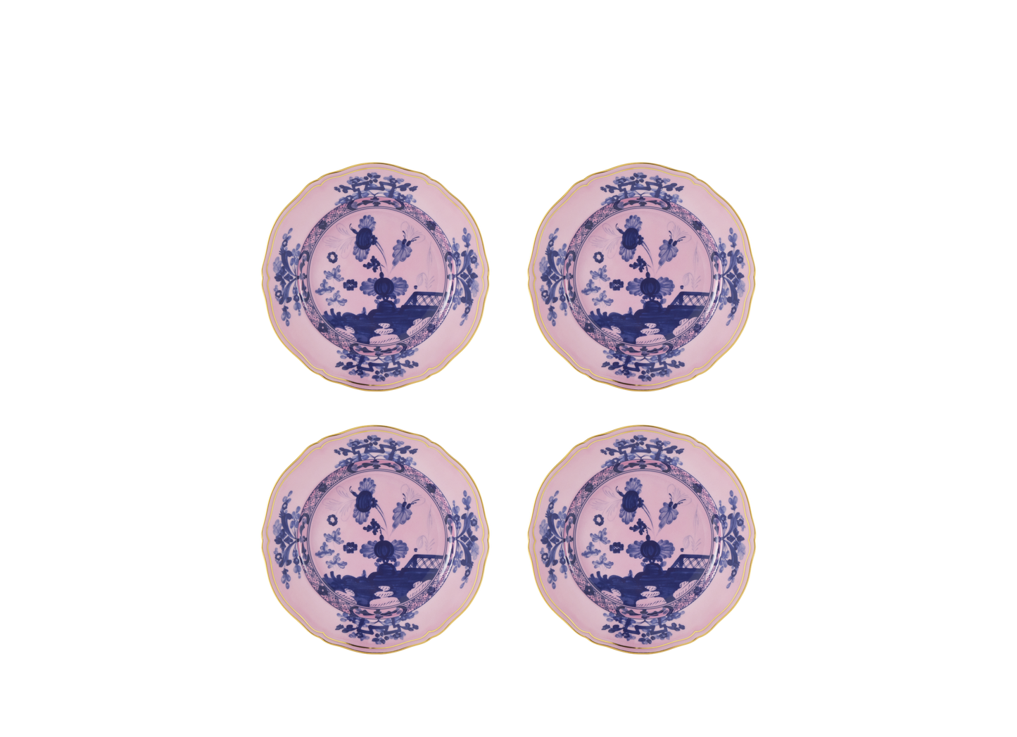 Set of four Azalea dessert plates from the Oriente Italiano collection, made of porcelain with gold threading. The plates feature a blue carnation motif against azalea pink, highlighted by hand-painted gold details on the classic Antico Doccia shape - set of four