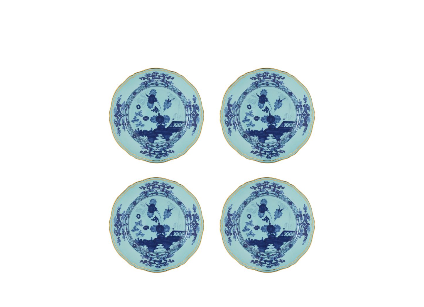 Set of four Iris dessert plates from the Oriente Italiano collection, featuring blue carnation motifs on iris blue porcelain with gold threading that outlines the Antico Doccia shape.