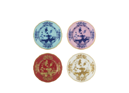 Set of four porcelain dessert plates from the Oriente Italiano collection, featuring gold threading and the Iris, Azalea, Rubrum, and Aurum designs. The plates showcase a signature carnation motif in contrasting tones with delicate hand-painted gold details