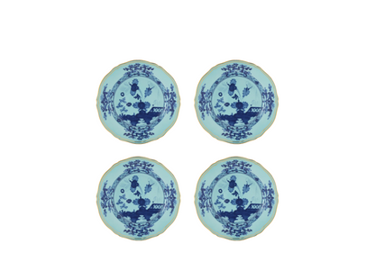Set of four Iris dessert plates from the Oriente Italiano collection, featuring blue carnation motifs on iris blue porcelain with gold threading that outlines the Antico Doccia shape.