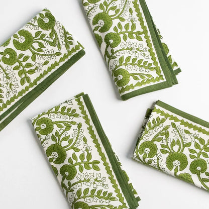 Set of four Cactus Flower Lettuce Green Napkins, 100% cotton, with a hand-block printed floral design in green. Perfect for casual and formal dining. Each napkin measures 20" x 20".