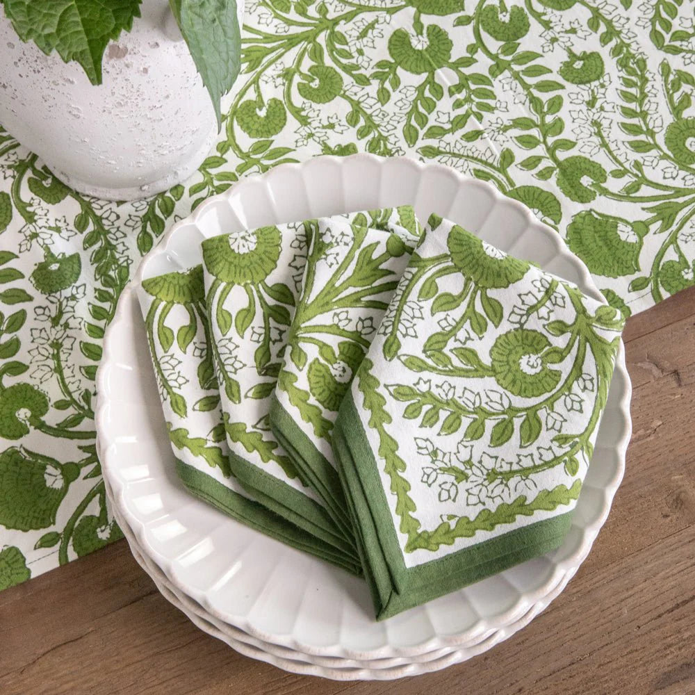 Set of four Cactus Flower Lettuce Green Napkins, 100% cotton, with a hand-block printed floral design in green. Perfect for casual and formal dining. Each napkin measures 20" x 20".