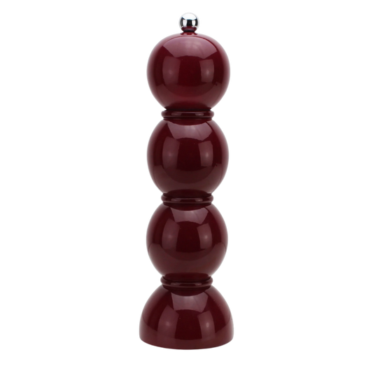 Cherry lacquered bobbin-shaped mill with stainless steel knobs for salt or pepper grinding, made from FSC-certified rubber wood with a glossy, hand-polished finish and a ceramic mechanism.