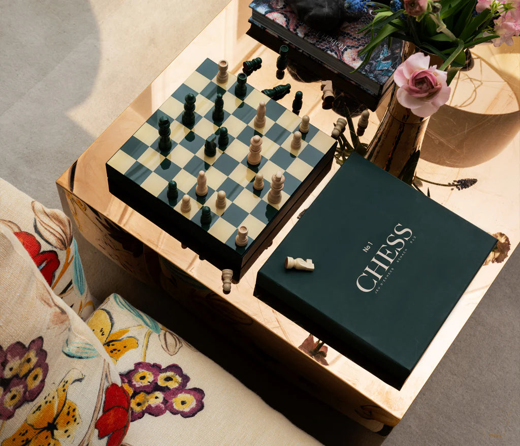 Classic Chess set with wooden pieces and a 25x25 cm MDF board with an acrylic top, accompanied by instructions in English, French, and German. Suitable for two players, ages 5+, perfect for display or play.