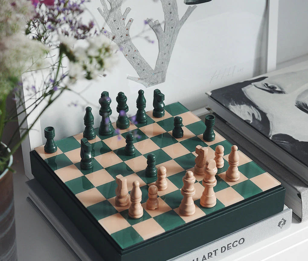 Classic Chess set with wooden pieces and a 25x25 cm MDF board with an acrylic top, accompanied by instructions in English, French, and German. Suitable for two players, ages 5+, perfect for display or play.