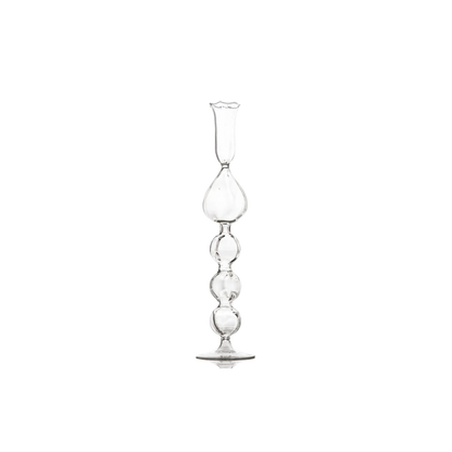 Clear Glass Candlestick with a unique handcrafted teardrop effect, perfect for adding a touch of luxury and warm candlelight to any setting.