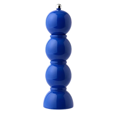 Cobalt blue lacquered bobbin-shaped mill with stainless steel knobs for salt or pepper grinding, made from FSC-certified rubber wood with a glossy, hand-polished finish and a ceramic mechanism.