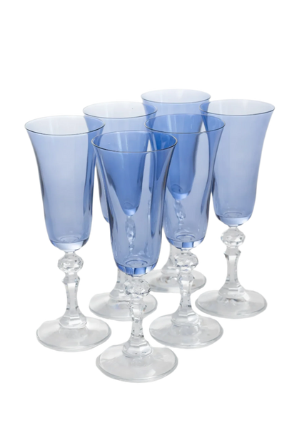 Set of 6 cobalt blue Regal Flutes with clear stems, hand-blown by artisans in Poland. Each flute stands 8 inches tall and holds 5 ounces. Lead, cadmium, and BPA-free for safe use. Limited edition.