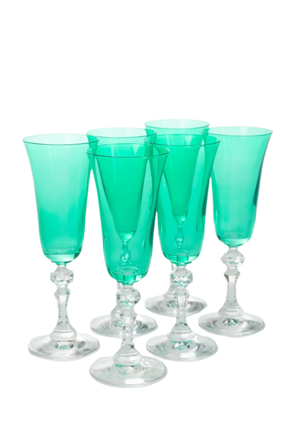 Set of 6 kelly green Regal Flutes with clear stems, hand-blown by artisans in Poland. Each flute stands 8 inches tall and holds 5 ounces. Lead, cadmium, and BPA-free for safe use. Limited edition.