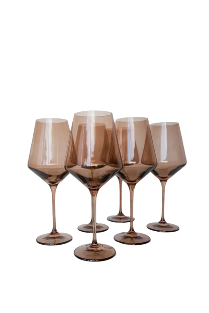 Amber smoke-colored wine stemware, hand-blown by Polish artisans. Each glass is 9.5 inches tall, holds 16.5 ounces, and comes in a set of 6. Lead, cadmium, and BPA-free for safe use.