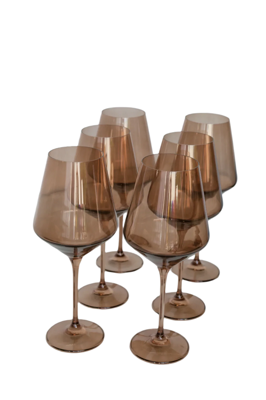 Amber smoke-colored wine stemware, hand-blown by Polish artisans. Each glass is 9.5 inches tall, holds 16.5 ounces, and comes in a set of 6. Lead, cadmium, and BPA-free for safe use.