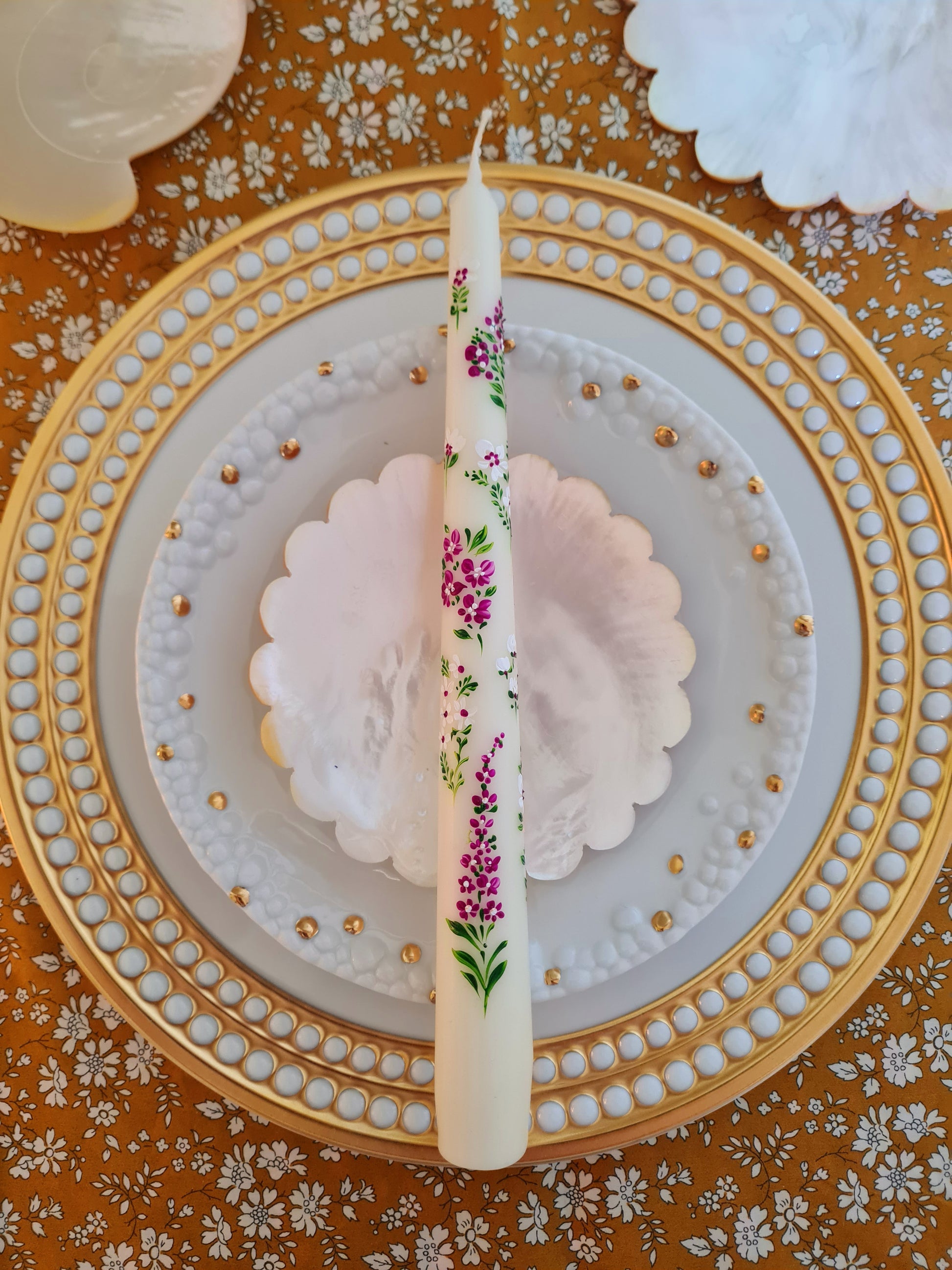 Hand-painted "English Country Garden" ivory taper candle, uniquely crafted and gift wrapped. Enjoy up to 5 hours of burn time, adding a charming, whimsical touch to your space.