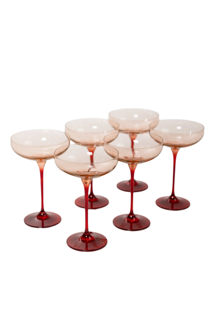 Blush Pink and Red Colored Champagne Coupe Set of 6, hand-blown by artisans in Poland. Lead, cadmium, and BPA-free glassware, 7.25 inches tall with an 8.25-ounce capacity. Limited edition.