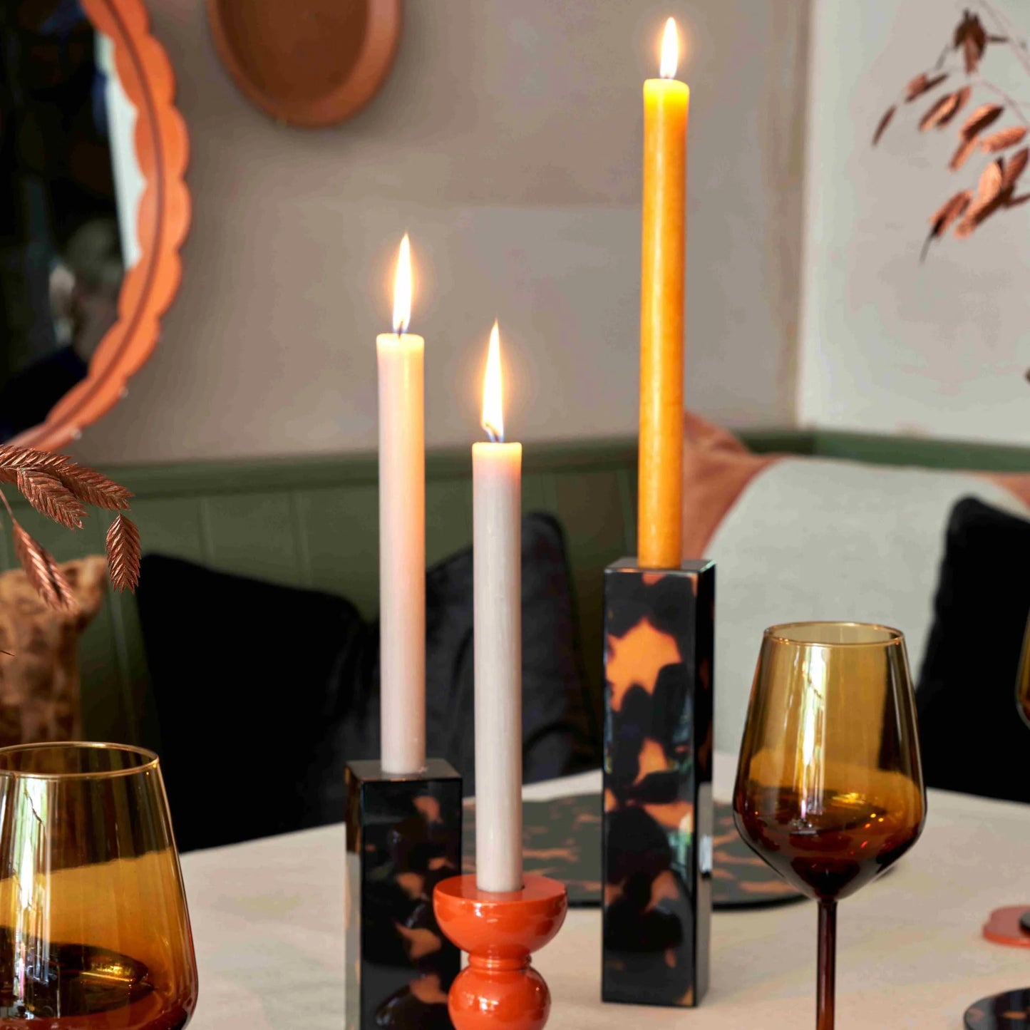 Tall faux tortoise shell lacquered bobbin-shaped candlestick made from FSC-certified rubber wood with a glossy, hand-polished finish, designed for standard dinner candles.