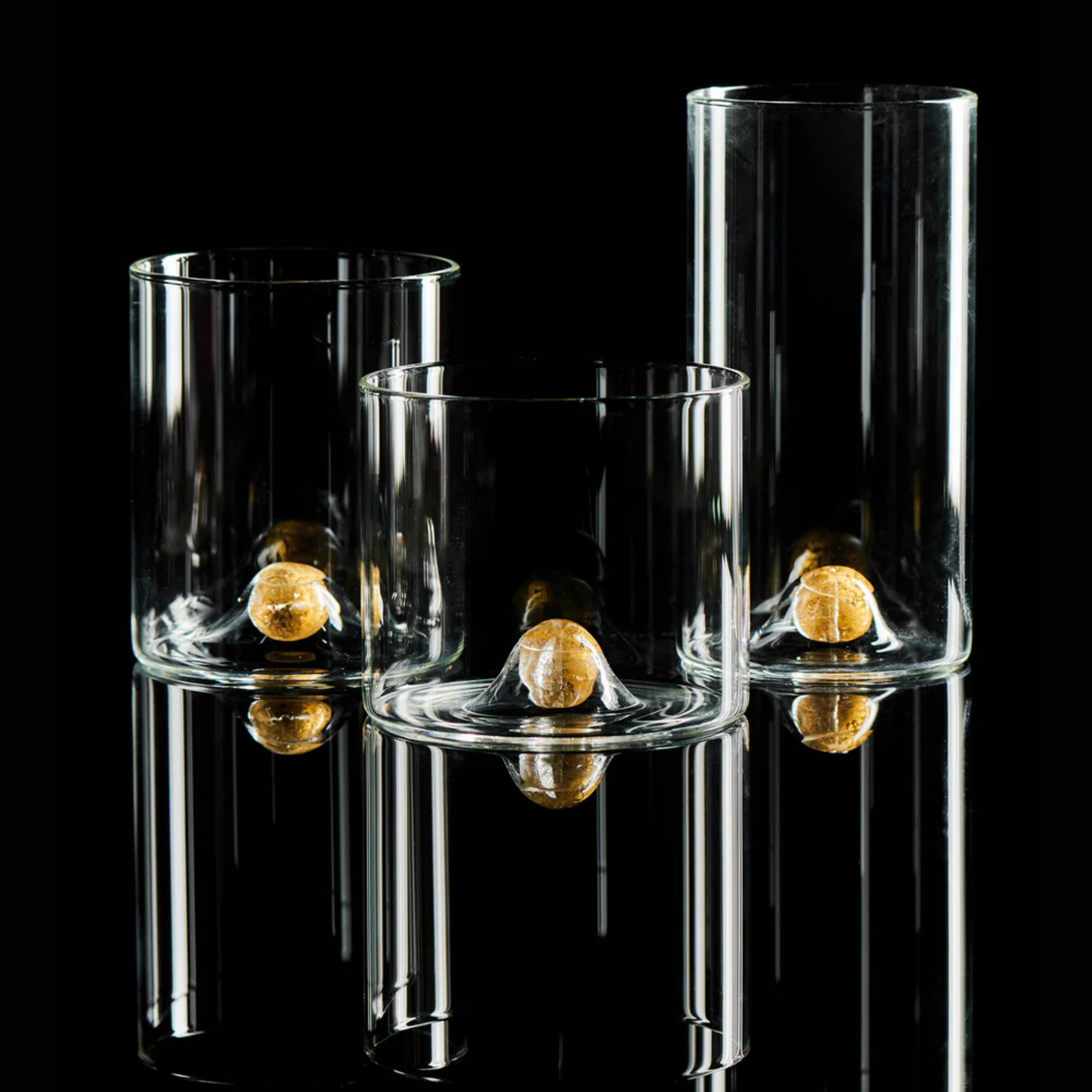 Double old-fashioned glasses with a distinctive gold ball detail at the base, adding sophistication and elegance to any table or drink presentation.