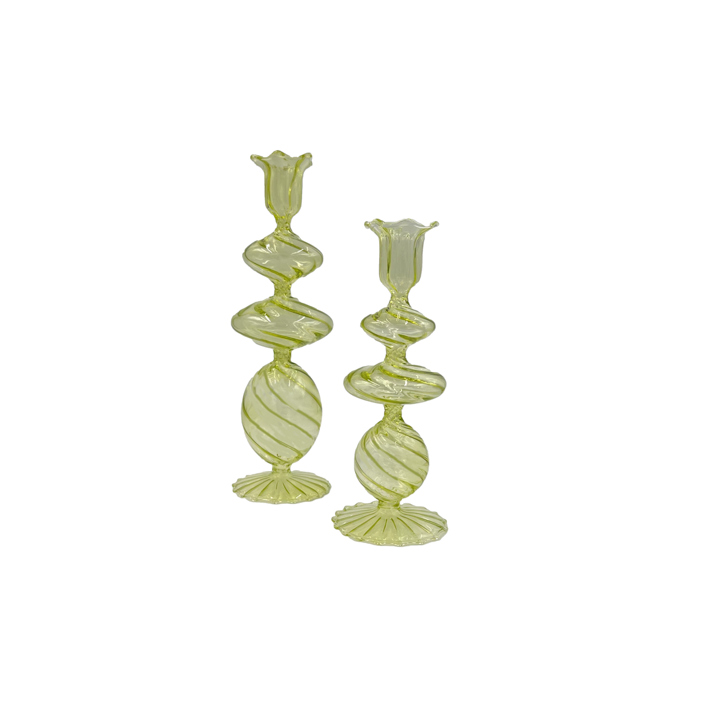 Charming green candlesticks made from mouth-blown borosilicate glass, perfect for adding a stylish touch to any dining table.