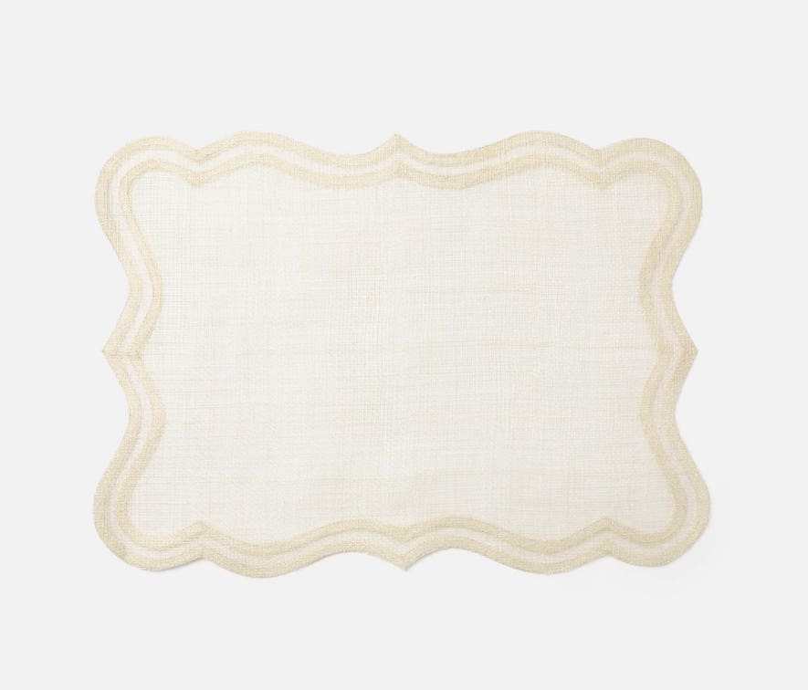 Lorisa Natural Placemat Set of 4 made from abaca fibers with reinforced edges for durability and sophistication, perfect for elegant table settings. Easy to clean and beautifully crafted.