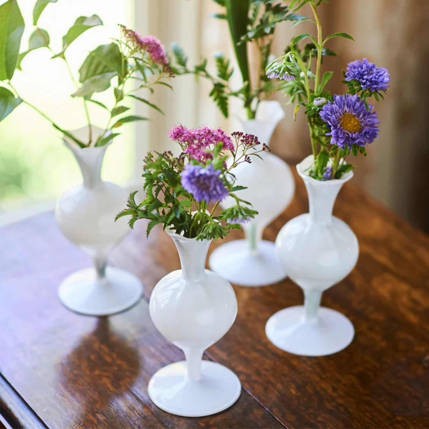 Pristine white bud vase, perfect for adding elegance to table settings or home décor.