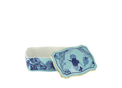 Iris rectangular porcelain box with cover from the Oriente Italiano collection, featuring a blue carnation motif on iris blue porcelain with hand-painted gold threading. Box measures 5.5 inches.