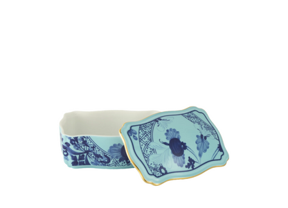 Iris rectangular porcelain box with cover from the Oriente Italiano collection, featuring a blue carnation motif on iris blue porcelain with hand-painted gold threading. Box measures 5.5 inches.