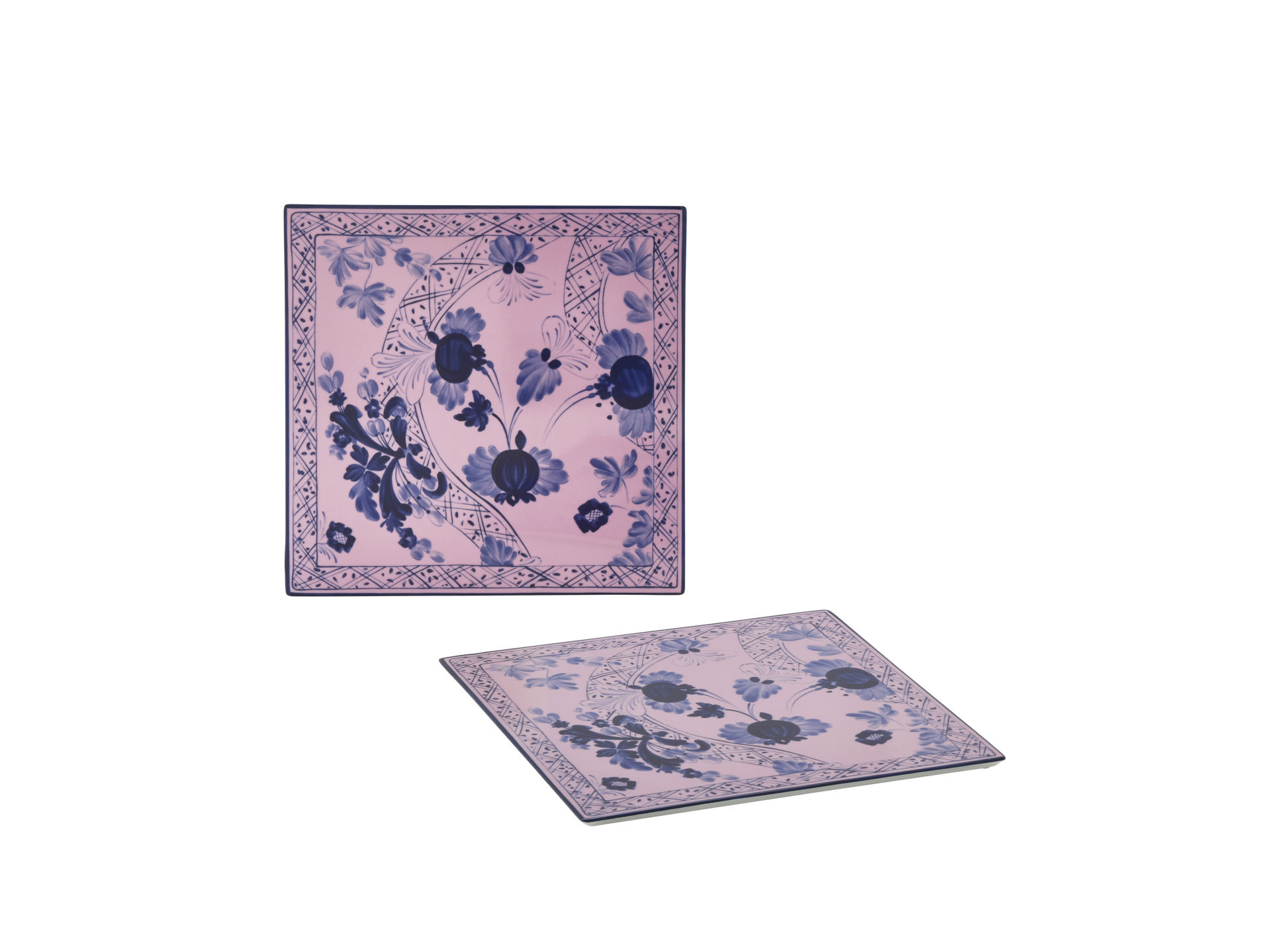 Set of 2 square porcelain placemats in Azalea from the Oriente Italiano collection, featuring a blue carnation motif with hand-painted gold threading against azalea pink porcelain