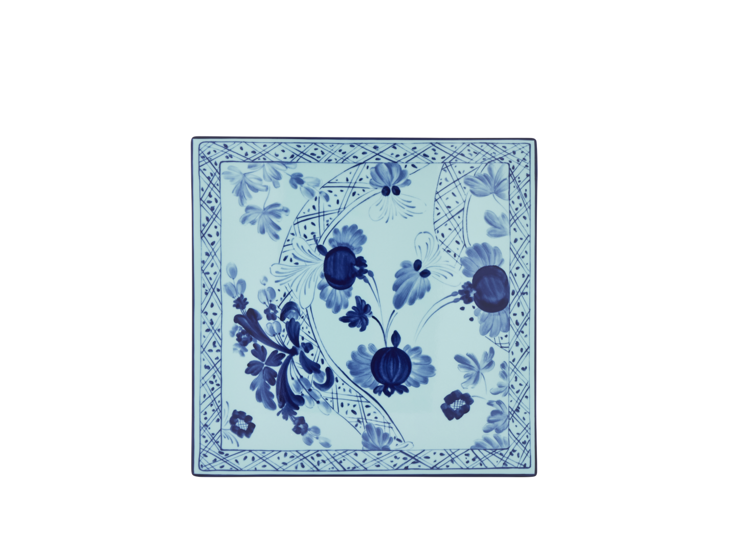 Set of 2 square porcelain placemats in Iris from the Oriente Italiano collection, featuring a blue floral pattern on an iris blue background with gold threading accents.