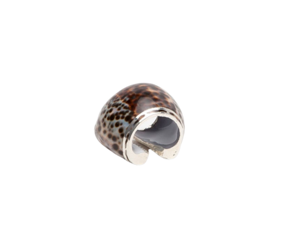 Olivia Tiger Cowrie Shell Napkin Rings, set of 4, featuring wide cowrie shells with silver accents. Stylish and easy to clean, perfect for sophisticated table settings.