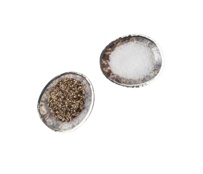 Penelope Pinch Bowls, set of 4 made from natural limpet shells with warm silver accents. Each bowl is unique, featuring elegant silver detailing. Easy to clean with a damp cloth.