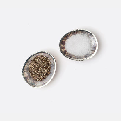 Penelope Pinch Bowls, set of 4 made from natural limpet shells with warm silver accents. Each bowl is unique, featuring elegant silver detailing. Easy to clean with a damp cloth.