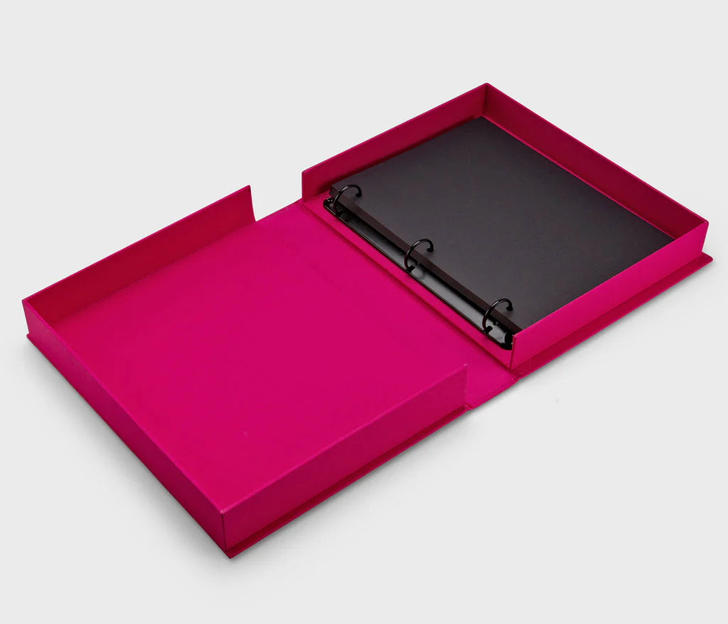 Picture Perfect Coffee Table Photo Album with a cerise cloth cover and orange text, containing 30 black photo paper pages for two 10x15 cm photos per page, with space for personal notes.