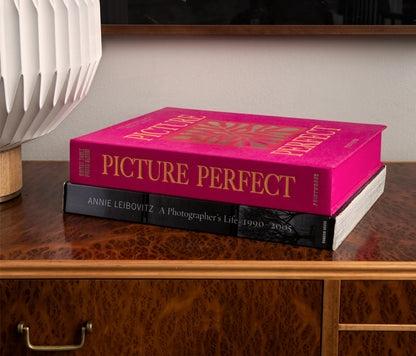 Picture Perfect Coffee Table Photo Album with a cerise cloth cover and orange text, containing 30 black photo paper pages for two 10x15 cm photos per page, with space for personal notes.