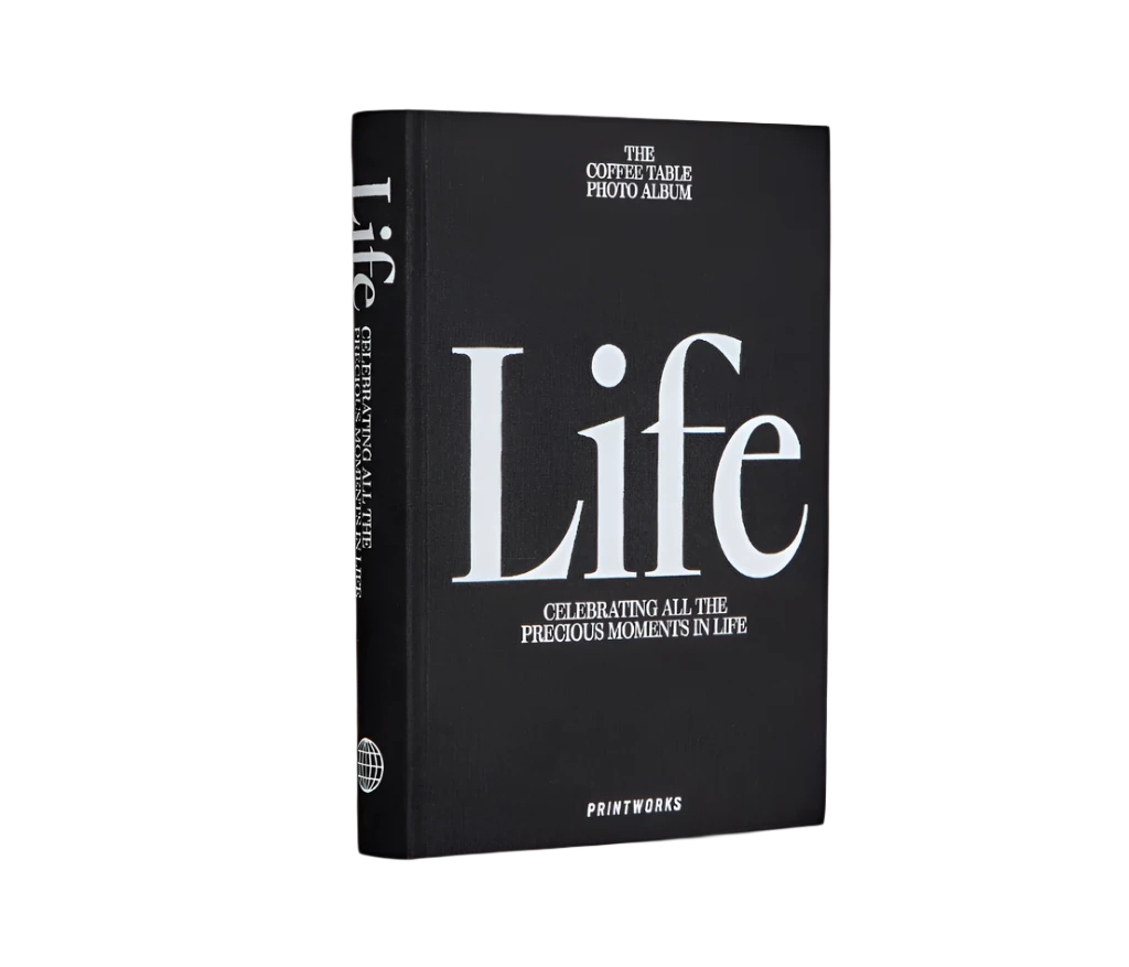 Sophisticated black photo book with 80 off-white pages for up to 160 photos, featuring expandable binding for a sleek coffee table look.