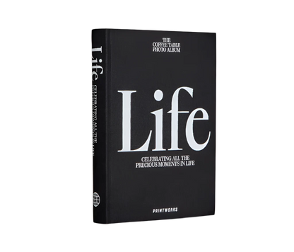 Sophisticated black photo book with 80 off-white pages for up to 160 photos, featuring expandable binding for a sleek coffee table look.