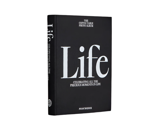 Sophisticated black photo book with 80 off-white pages for up to 160 photos, featuring expandable binding for a sleek coffee table look.