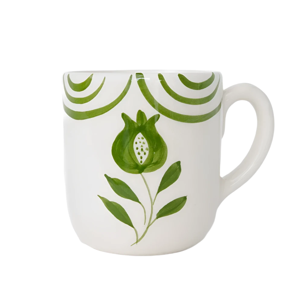 Set of 2 Pomegranate Crest Green Mugs featuring a bold hand-painted pomegranate design with delicate green arcs. Made from 100% ceramic, these mugs are microwave and dishwasher safe. Perfect for coffee, tea, or hot chocolate. Made in Portugal.