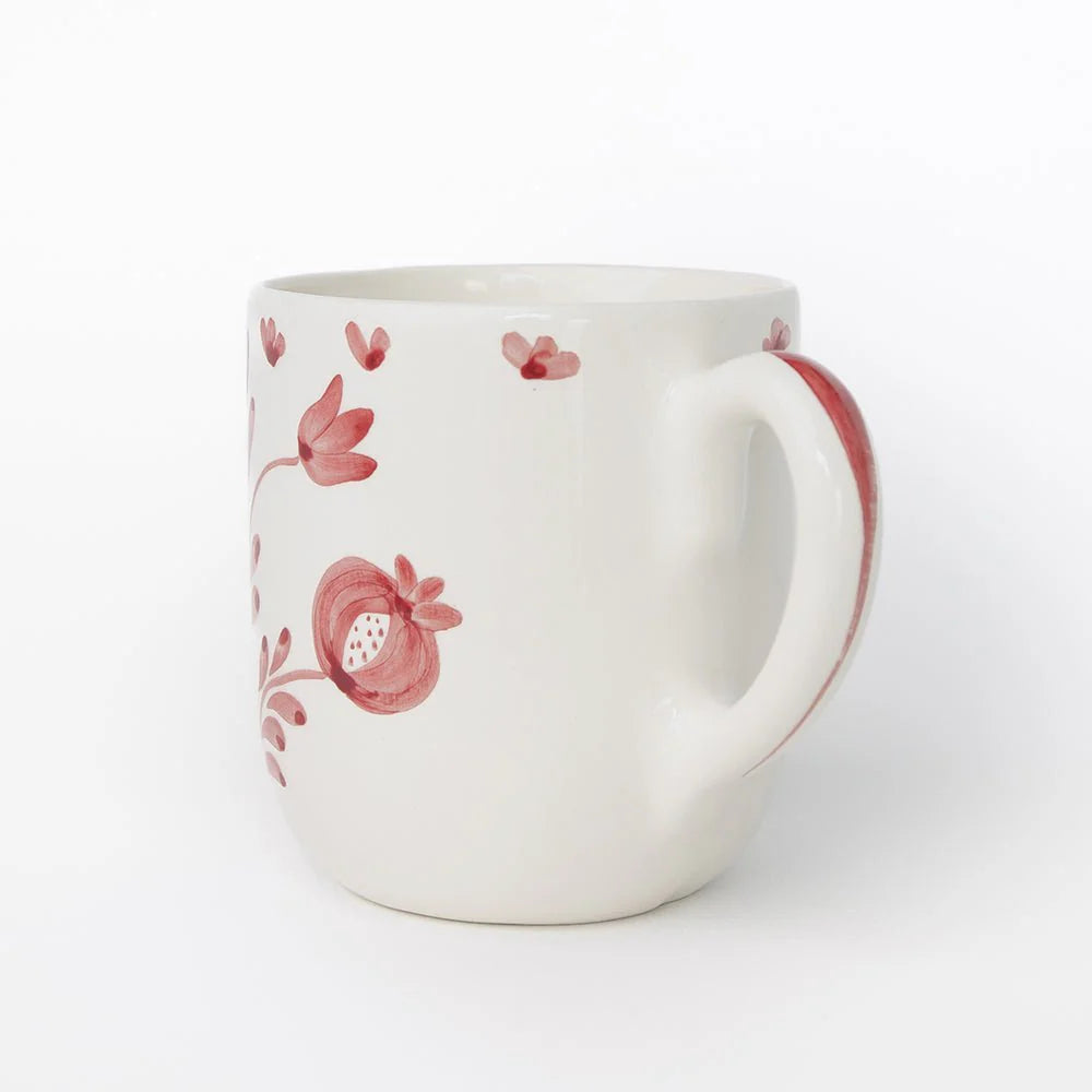 Set of 2 Pomegranate Duet Rose Mugs featuring hand-painted pomegranate designs and soft floral elements in rose pink. Each mug is 100% ceramic, microwave and dishwasher safe. Perfect for enjoying tea, coffee, or hot cocoa. Made in Portugal