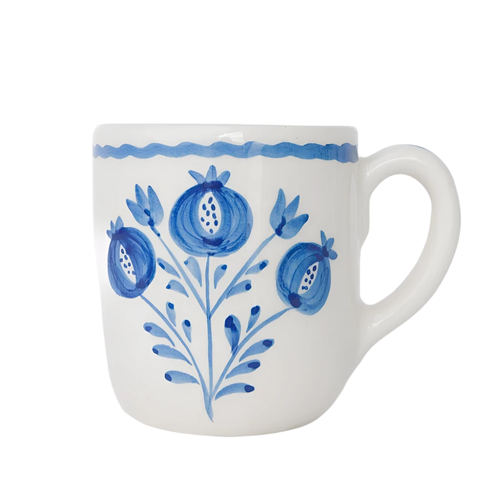 Set of 2 Pomegranate Trio Sketch Cobalt Blue Mugs featuring vibrant hand-painted pomegranates in rich cobalt blue. Made from 100% ceramic, these mugs are microwave and dishwasher safe. Perfect for enjoying coffee, tea, or hot chocolate. Made in Portugal.