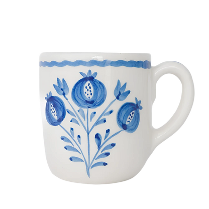 Set of 2 Pomegranate Trio Sketch Cobalt Blue Mugs featuring vibrant hand-painted pomegranates in rich cobalt blue. Made from 100% ceramic, these mugs are microwave and dishwasher safe. Perfect for enjoying coffee, tea, or hot chocolate. Made in Portugal.