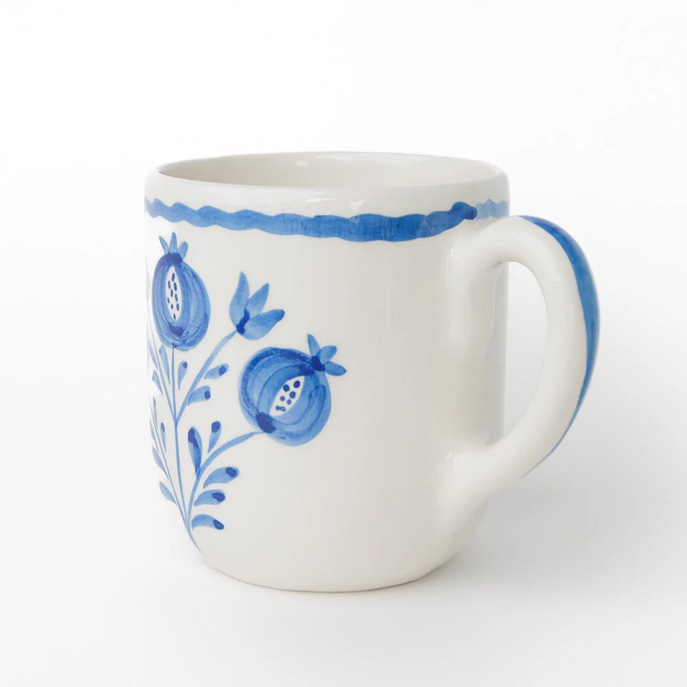 Set of 2 Pomegranate Trio Sketch Cobalt Blue Mugs featuring vibrant hand-painted pomegranates in rich cobalt blue. Made from 100% ceramic, these mugs are microwave and dishwasher safe. Perfect for enjoying coffee, tea, or hot chocolate. Made in Portugal.