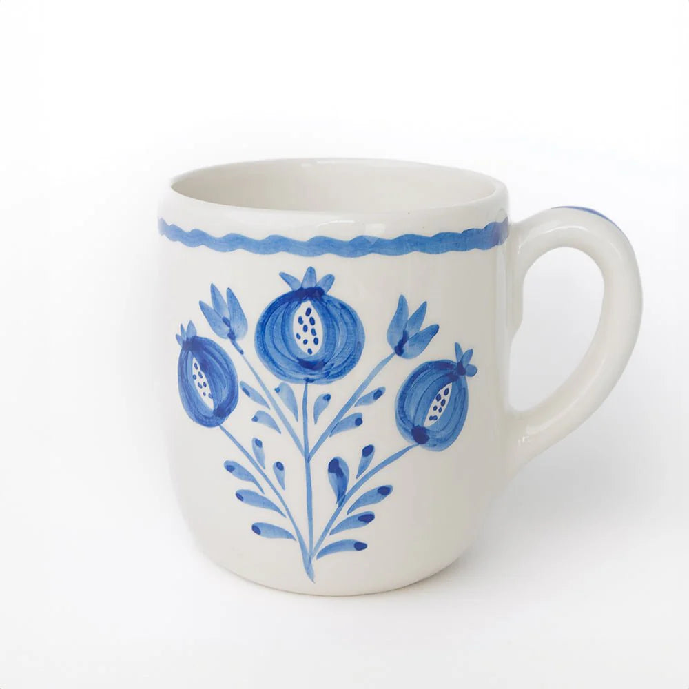 Set of 2 Pomegranate Trio Sketch Cobalt Blue Mugs featuring vibrant hand-painted pomegranates in rich cobalt blue. Made from 100% ceramic, these mugs are microwave and dishwasher safe. Perfect for enjoying coffee, tea, or hot chocolate. Made in Portugal.