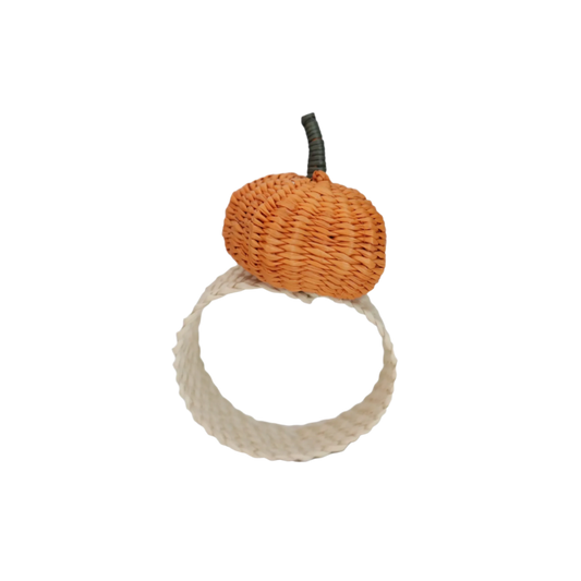 Handcrafted Pumpkin Napkin Ring made from Iraca Palm by artisans in Colombia. This charming autumn decor piece measures 2" x 1.5" and adds a festive touch to any table. Clean with a damp cloth or toothbrush to maintain its beauty.