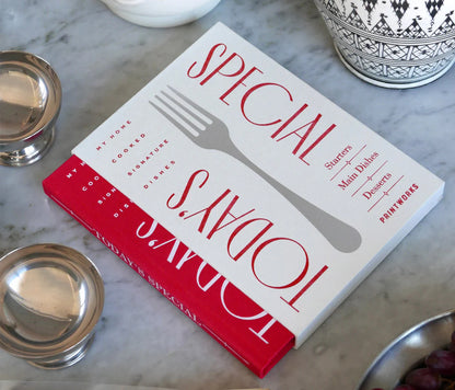 Elegant red recipe book with 50 sheets of wood-free paper, lined for ingredients and directions, stored in an ivory white slipcase for protection. Ideal for writing down your favorite dishes.