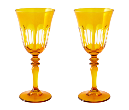 Rialto Wine Glass, set of 2, inspired by Venice's Rialto Bridge. Handcrafted in Turkey, each glass features unique color and cutwork. Holds 9 oz and perfect for adding a festive touch to your table. Hand-wash with a soft cloth and soapy water.