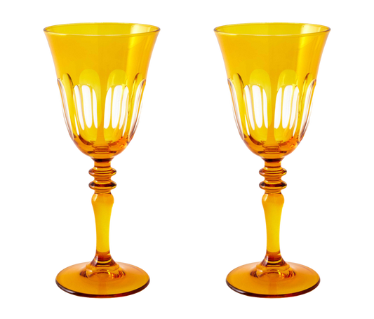 Rialto Wine Glass, set of 2, inspired by Venice's Rialto Bridge. Handcrafted in Turkey, each glass features unique color and cutwork. Holds 9 oz and perfect for adding a festive touch to your table. Hand-wash with a soft cloth and soapy water.