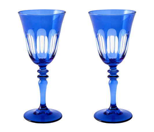 Rialto Wine Glass, set of 2, inspired by Venice's Rialto Bridge. Handcrafted in Turkey, each glass features unique color and cutwork. Holds 9 oz and perfect for adding a festive touch to your table. Hand-wash with a soft cloth and soapy water.