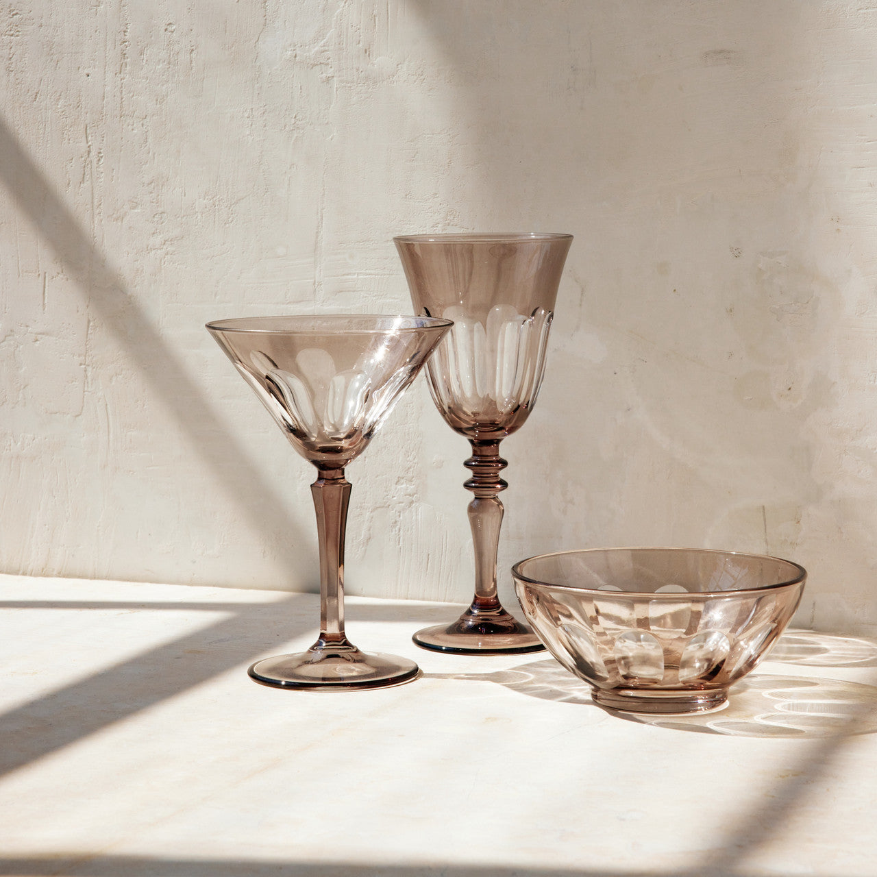 Rialto Wine Glass, set of 2, inspired by Venice's Rialto Bridge. Handcrafted in Turkey, each glass features unique color and cutwork. Holds 9 oz and perfect for adding a festive touch to your table. Hand-wash with a soft cloth and soapy water.